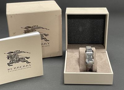 a box with a watch inside of it and a box with a watch inside of it