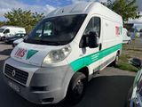 a white van that is parked in a parking lot