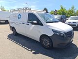 a white van that is parked in a parking lot