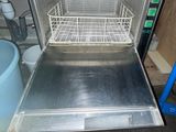 a metal dishwasher inside of a small kitchen