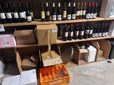 many bottles of wine on the shelves in the store