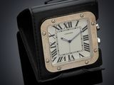 an image of a black and white clock with roman numerals