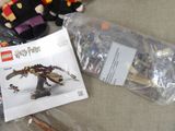 a bag of lego harry potter toys and a bag of harry potter figurines