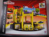a box with a toy car garage inside of it