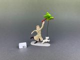 a figurine of a man with a bird and a dog