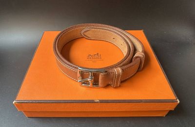 a close up of a belt on a box on a table