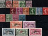 several different colored stamps are arranged on a black surface