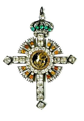 a close up of a cross on a white background with a white background