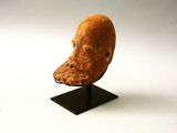 a sculpture of a bird head on a black stand