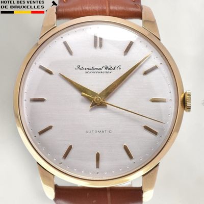 an image of a close up of a wrist watch on a white surface