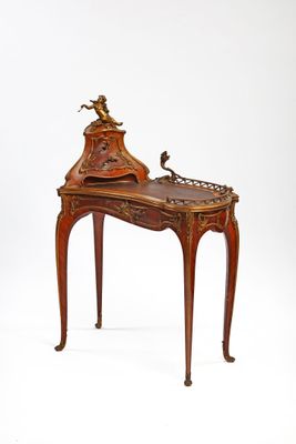 a small desk with a clock on top of it