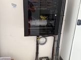 a box with a bunch of wires on it in a room
