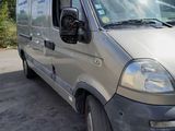 a silver van that is parked in a parking lot