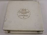 a small white box with a stamp on it on a table