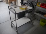 a cart with a box on top of it in a garage