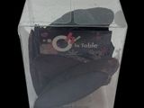 a clear box with a chocolate cake inside of it