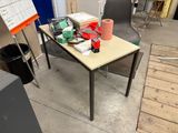 a table with a roll of toilet paper and a roll of toilet paper on it