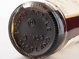 a close up of a bottle of wine on a table