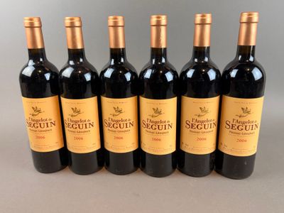 six bottles of red wine are lined up in a row