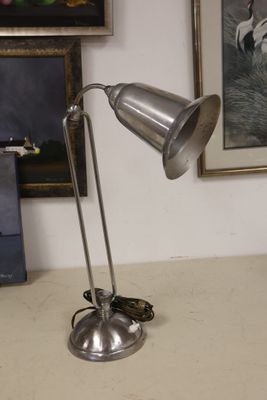 a lamp that is sitting on a table in a room