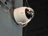 a camera attached to the side of a wall