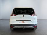 the rear end of a white car in a white room