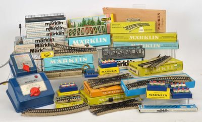 a pile of toy train tracks and other toy trains