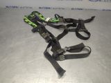 a close up of two black and green straps on a table