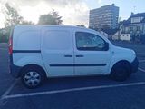 a white van that is parked in a parking lot