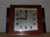 a clock that is sitting on a table in a room
