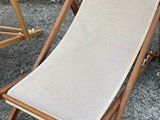 two chairs that are sitting next to each other on the pavement