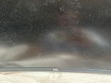 a dell monitor sitting on a bed in the room
