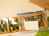 a picture of a picture of a man in a picture frame on the floor