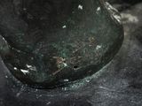a close up of a bronze statue of a horse
