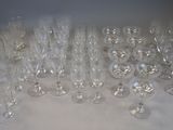 a lot of wine glasses sitting on a table