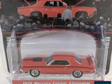 the red die - cast car is in a plastic package