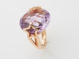 an amethorate and gold ring with a star