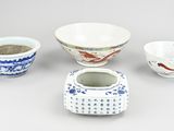 several different types of asian bowls and bowls on a gray surface