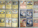a lot of pokemon cards that are on the table