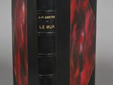 an image of a book with a red cover and black binding