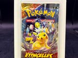 a close up of a pokemon trading card in a package