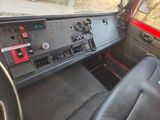 a dashboard of a car with a radio and other items in it