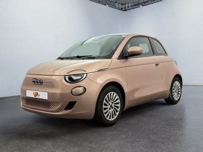 the smart car is parked in a showroom with a white wall