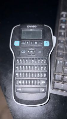 a black and white keyboard and a black and white keyboard on a desk