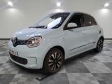 a picture of a small white car parked in a garage