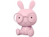 a pink rabbit with glasses sitting on a white surface