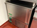 an image of a commercial ice cream machine in a commercial kitchen