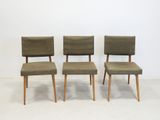 three mid century style dining chairs with upholstered backrests