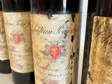 several bottles of wine are lined up on a table