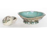 three pieces of pottery including a bowl and a bowl with a lid